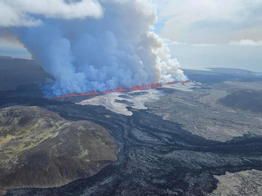 Watch Live: "Explosive" Iceland volcano eruption shoots lava across roads and sends pollution toward the capital