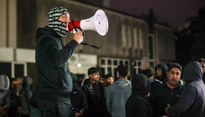Hundreds of protesters gather outside Rochdale Police Station after video shows officer stamping on man's head