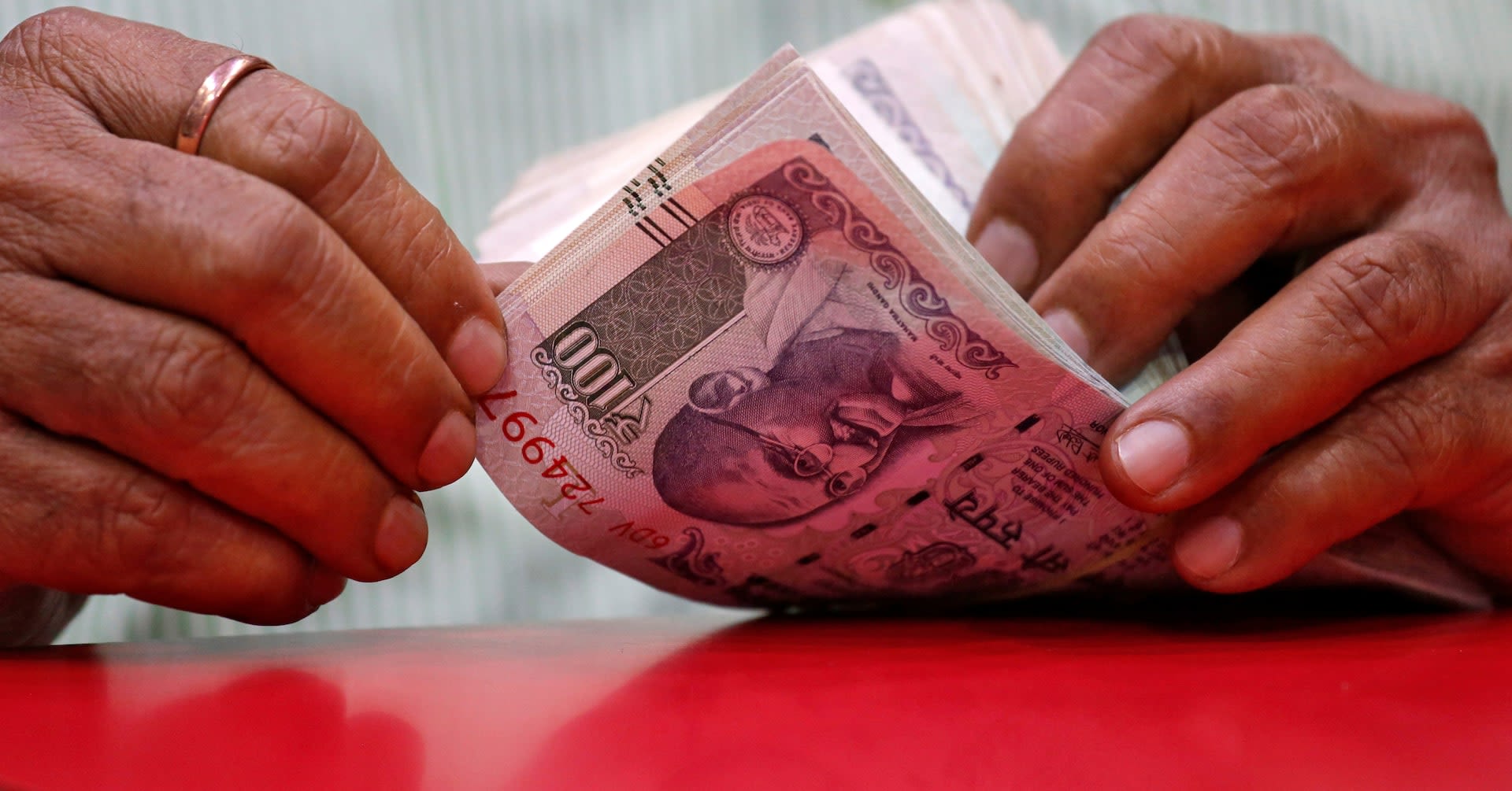 Rupee subdued tracking Asian peers, bias seen tilted lower