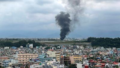 Plane crashes at airport in Nepal's capital just after takeoff, killing 18 people and injuring pilot