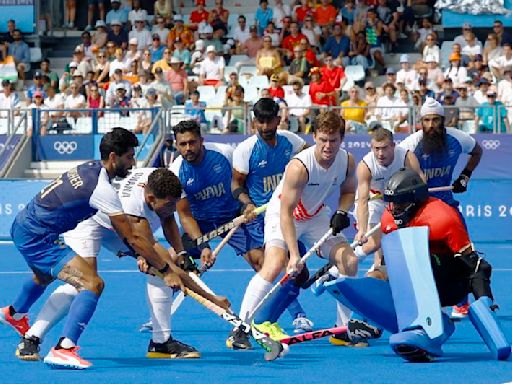 Olympics-Hockey-Belgium beat India to stay top, Britain, Argentina advance