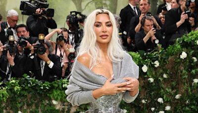 Kim Kardashian Explains Why She's Awkwardly Holding a Sweater at Met Gala