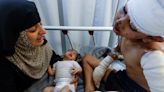 Young Gaza boy wounded and loses mother in Israeli airstrike