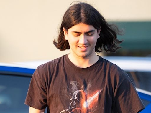Michael Jackson’s reclusive son Blanket charges his Tesla during rare outing