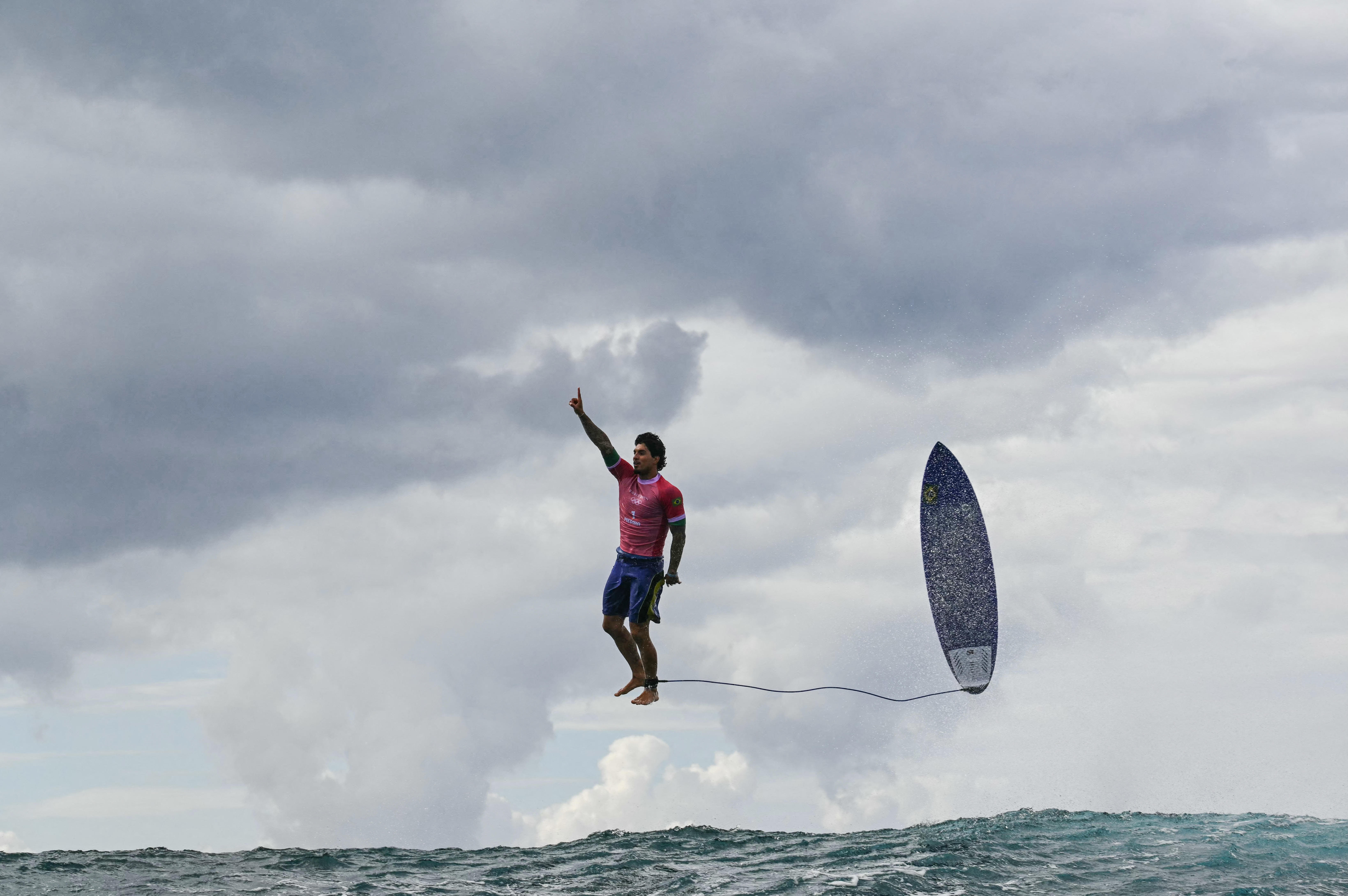 Olympic surfing photo goes viral. Some question if it's too good to be true.