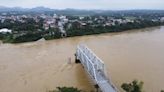 Bridge collapses as more rain falls in Vietnam, raising storm death toll to 21