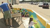 SPARK gives kids a chance to paint barricades and prepare for summer