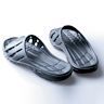 Slides with sporty designs and materials, perfect for use as post-workout footwear or for casual outings. Often feature a thick sole for added cushioning and support.