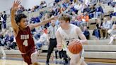 Stow pulls away late from Hudson boys basketball