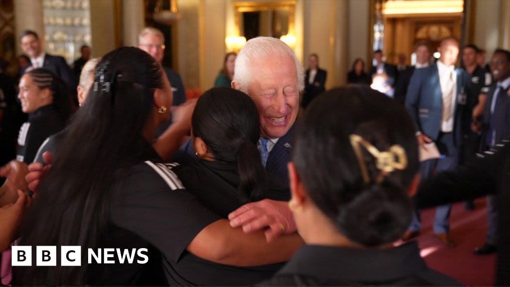 King Charles surprised by hug with rugby players from New Zealand