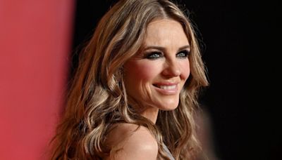 Elizabeth Hurley, 59, twirls in plunging rainbow gown