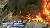 Huge fire burns West Town pallet yard to the ground as hundreds of Chicago firefighters battle blaze