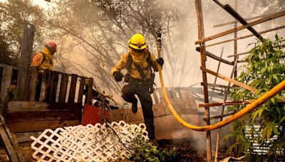 Wildfire sparked by a burning car triples in size in a day. A 42-year-old man is arrested