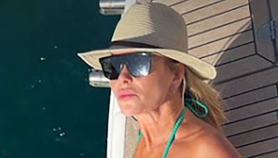 Amanda Holden shows off impeccable figure as she strips down to skimpy bikini