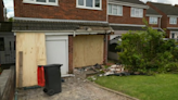 Car crashes into front of house in village