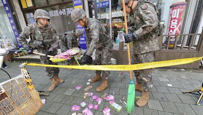 Trash dropped by a North Korean balloon falls on South Korea's Presidential compound