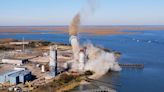 Going, going, gone: Watch as a notorious power plant is demolished to make way for offshore wind