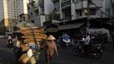 E-waste is overflowing landfills. At one sprawling Vietnam market, workers recycle some of it