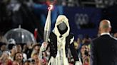 Mystery masked Olympic torchbearer revealed in deleted Instagram post