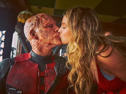 Blake Lively is seen kissing her husband Ryan Reynolds