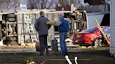Homeowner J.R. Henderson, right, thanks his American Family insurance agent Brett Wuerflein after Wuerflein inspected damage to Henderson...