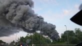 Huge plume of smoke as firefighters tackle industrial estate blaze