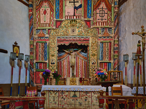 An annual pilgrimage during Holy Week brings thousands of believers to Santuario de Chimayó in New Mexico