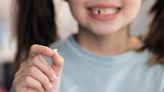 Tooth fairy gifts children $100 bills and designer jewellery