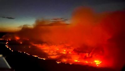 Thousands evacuate as wildfire grows ‘dramatically’ in western Canada