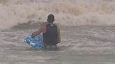 Galveston's got SURF! Surfers hit the beach as high winds hit the coast