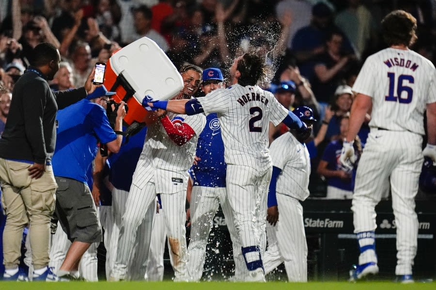 Hoerner’s infield chopper plates winning run in 10th as Cubs open home series vs. Braves with 4-3 victory