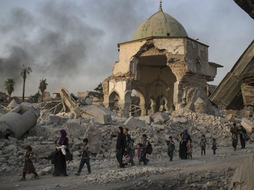 UNESCO finds Islamic State group-era bombs in Mosul mosque walls, years after the defeat of IS