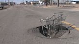 Drivers ignore signs, pass by large sinkhole on Denver street