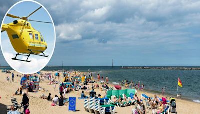 Air ambulance lands at beach as two rescued from sea