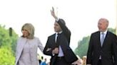 President Emmanuel Macron, centre, and his wife Brigitte Macron with Berlin's Mayor Kai Wegner at the Brandenburg Gate in Berlin on Sunday
