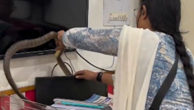 Watch: Fearless Woman Catches Snake Hiding Behind An Office Computer With Bare Hands - News18