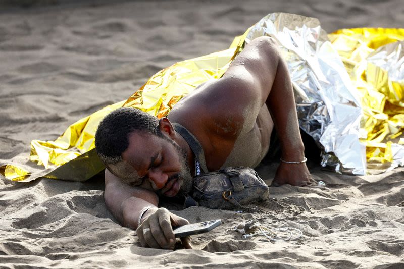 Exhausted migrants arrive on beach in Spain's Canaries