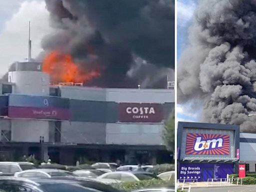 Huge factory fire breaks out with smoke plume visible 15 miles away