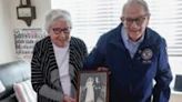 World War II veteran Richard Rung and his wife Dorothy hold their wedding photo a day after the 75th anniversary of their marriage