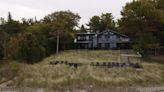 Battle over $150K beachfront wall pits neighbour against neighbour in Grand Bend, Ont.