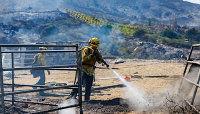 Weather shift gives firefighters an edge in battling three large Southern California wildfires