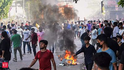 32 dead in Bangladesh unrest, protesters set fire to state TV network