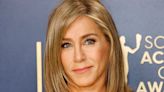 At 55, Jennifer Aniston Shows Off Toned Arms and Leg in High-Slit Gown