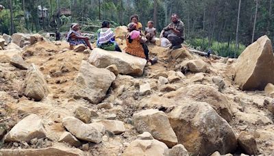 As many as 2,000 people feared buried under Papua New Guinea landslide as survivors dig with hands and spades