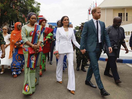 Meghan Markle Nails Business Chic in an All-White Suit on Her Nigerian Tour