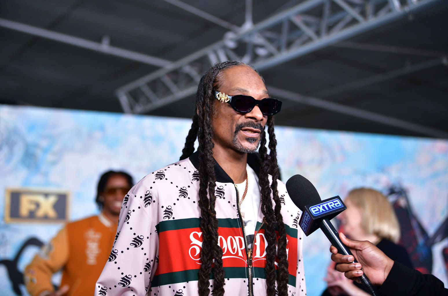 Snoop Doog’s Granddaughter Helping Him Brush Up on French Before His Summer Olympics Gig Is Pure Gold