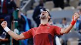 Novak Djokovic keeps his French Open title defense going by getting past Lorenzo Musetti in 5 sets