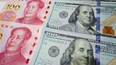 Chinese yuan: Currency hits record lows against US dollar