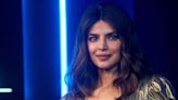 Priyanka Chopra just wore a TDF gold gown with a plunging V-neckline