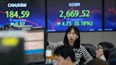 Stock market today: Asian shares are mixed as China unveils 5% economic growth target for 2024
